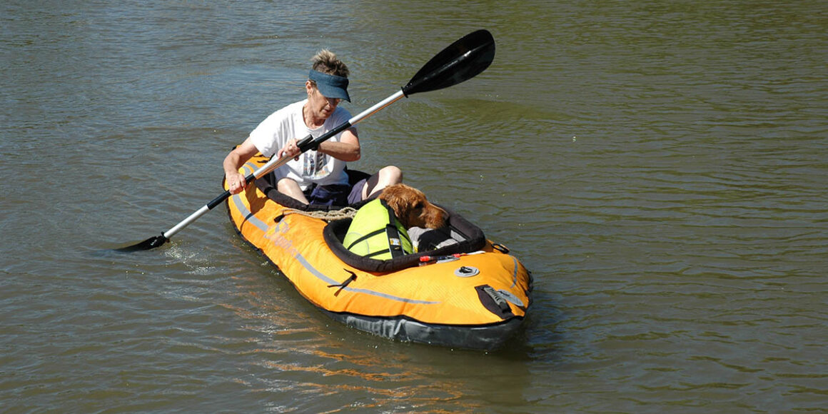 Dog and lady in raft